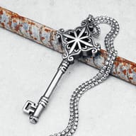 Close-up of the ornate top of the 316L stainless steel key pendant necklace with scrollwork