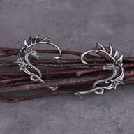 Detailed shot of the textured scales and antiqued finish on the dragon ear jewelry