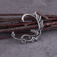 Left and right winged dragon ear cuff earrings displayed side by side