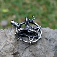 Close-up of the intricate ram head and twisted horns within the pentagram, detailed texture visible