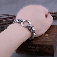 Men's neo-gothic skull Byzantine bracelet displayed next to wooden gift box