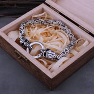 Close-up of sculpted cracked skull terminals and circular spring clasp on stainless steel bracelet