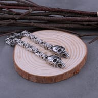 Detailed profile of gothic skull accents and polished stainless steel chain links