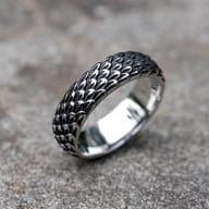 Close-up of the textured dragon scale design on the men's stainless steel ring.