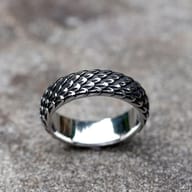 Detail view of the intricate dragon scale pattern on the vintage Nordic ring.