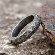 Rustic and powerful, this stainless steel rune ring captures ancient Viking aesthetics.