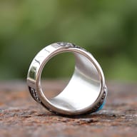 Side profile of the Viking ring, showcasing the textured 316L stainless steel band and the full howling wolf design.