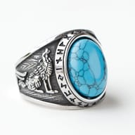 Detailed view of the ring's design, emphasizing the dark oxidized details of the wolf and rune carvings on the 316L stainless steel.