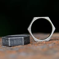 Detail shot of the lower facets of the hexagon ring, emphasizing the unique shape and runic symbols.