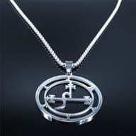 Close-up showing the side of the 316L stainless steel Lilith seal pendant and the box chain's texture against a dark, rocky background.