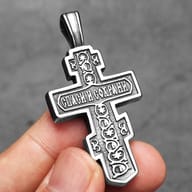 Close-up of the top portion of the Orthodox Crucifix pendant, highlighting the detailed bail and inscription.