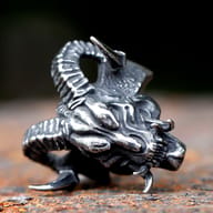 316L stainless steel gothic devil skull ring worn on a man's finger, showcasing its scale and fit.