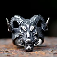 Close-up of the intricate horn and forehead design of the stainless steel gothic skull ring.