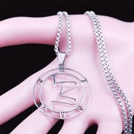 Close-up of the 316L stainless steel Mammon sigil pendant's bail and top outline.