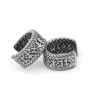 Pair of Norse Viking rune clip earrings showing durability and metal texture