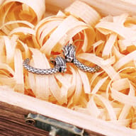 Men's dragon hoop earring worn on ear showing scale and fit