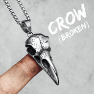 Gothic Crow Skull 316L Stainless Steel Pendant Necklace displayed on a finger with a robust chain.