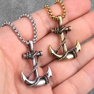 Close-up of the stainless steel anchor pendant, highlighting the 'SILVER ANCHOR' text on a gray background.