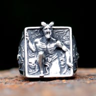Angled view of gothic Lucifer ring highlighting detailed 3D engraving and polished bevel edges