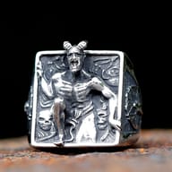 Front view of men's stainless steel Lucifer fallen angel signet ring showing horned demon relief and skulls