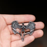 Another close-up of the winged skeleton pendant, emphasizing the chest and wing structure.