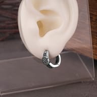Stainless steel Viking rune hoop earrings showing the secure hinged snap closure