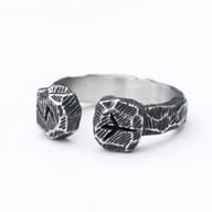 Front angle view of stainless steel Viking rune open cuff ring with textured finish