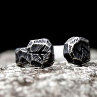 Viking rune cuff ring worn on finger highlighting fit and proportion