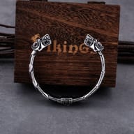Viking wolf head cuff bracelet displayed showing the back hinge detail and band structure