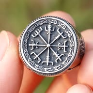 Close-up of the oxidized black finish and raised steel details on the Vegvisir ring face