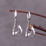 Side angle showing the hoop clasp and textured handle of the Viking axe drop earring