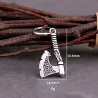 Pair of 316L stainless steel axe drop hoop earrings resting against a jewelry box