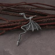 Side angle view of the gothic dragon drop earrings highlighting the dimensional wing design