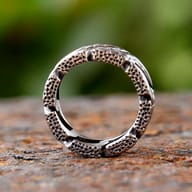 Angled shot highlighting the interwoven design of the durable stainless steel ring