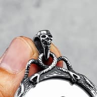 Side profile of the stainless steel pendant showing its depth and texture