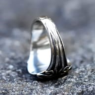 Angled shot of the Lucifer sigil signet ring, showcasing its robust construction.