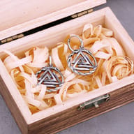 Detailed view of the dragon Ouroboros border and secure hoop clasp on the earring
