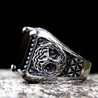 Detailed view of the Yggdrasil tree pattern engraved on the side of the ring's band.