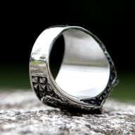 Angled close-up of the Viking ring, highlighting the robust 316L stainless steel setting around the black stone.