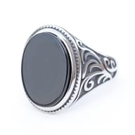 Angled view of the luxury men's ring revealing the full totem-inspired design and craftsmanship