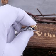 Detailed view of the clasp mechanism on the two-tone steel chain