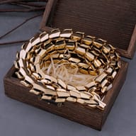 Side angle showing the fluid articulation of the dragon scale chain