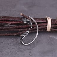 Side profile highlighting the ergonomic hook silhouette of the wrap earring