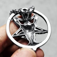 Detailed view of the Baphomet head and inverted pentagram design on the stainless steel pendant.