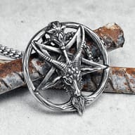 Lower left view of the Gothic Baphomet Pentagram pendant, highlighting its texture and design, held by fingers.