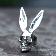Angled perspective showing the upright bunny ears and sculpted skull face