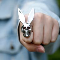 Stainless steel gothic skull rabbit ring worn on a hand for scale