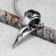 Side profile of the 316L stainless steel crow skull pendant, emphasizing its sleek finish.