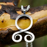 Back side view of the stainless steel Viking troll cross pendant