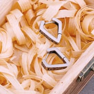 Front angle view of engraved rectangular stainless steel hoop earrings